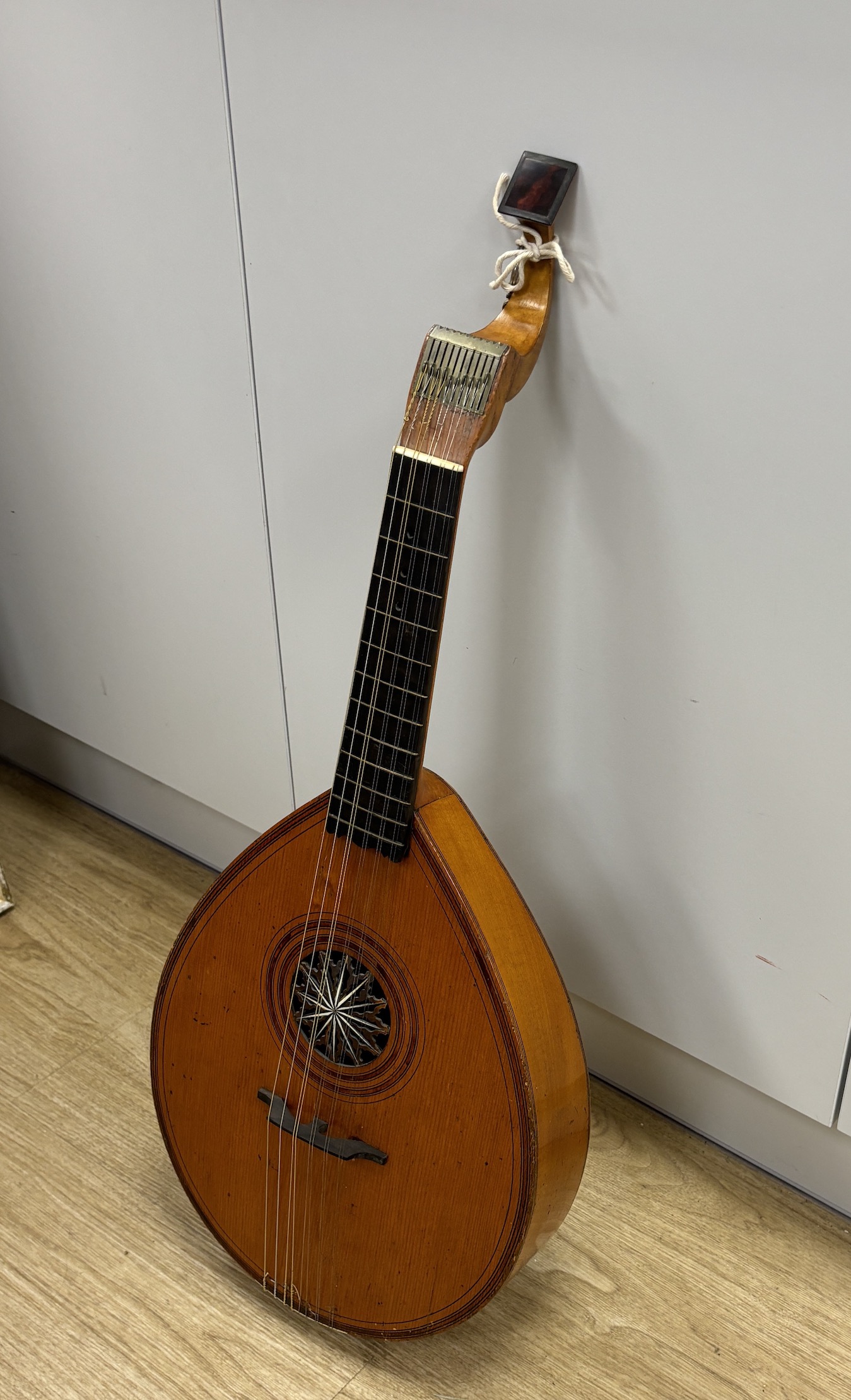 An 18th century English guitar, c.1760-80, possibly of London manufacture by Preston or Hintz, with ten watch key tuned strings, with maple back and neck, spruce soundboard, three original square section holes intended f